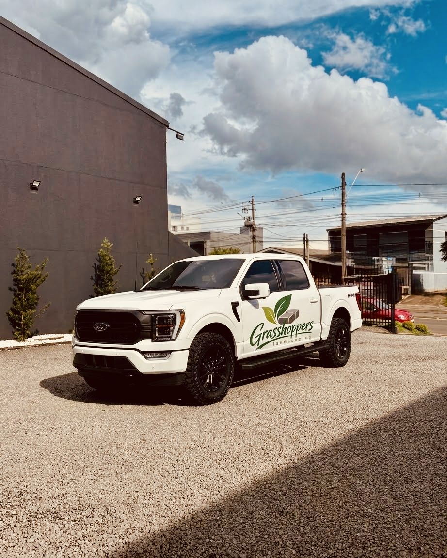 Grasshoppers Landscaping branded pickup truck