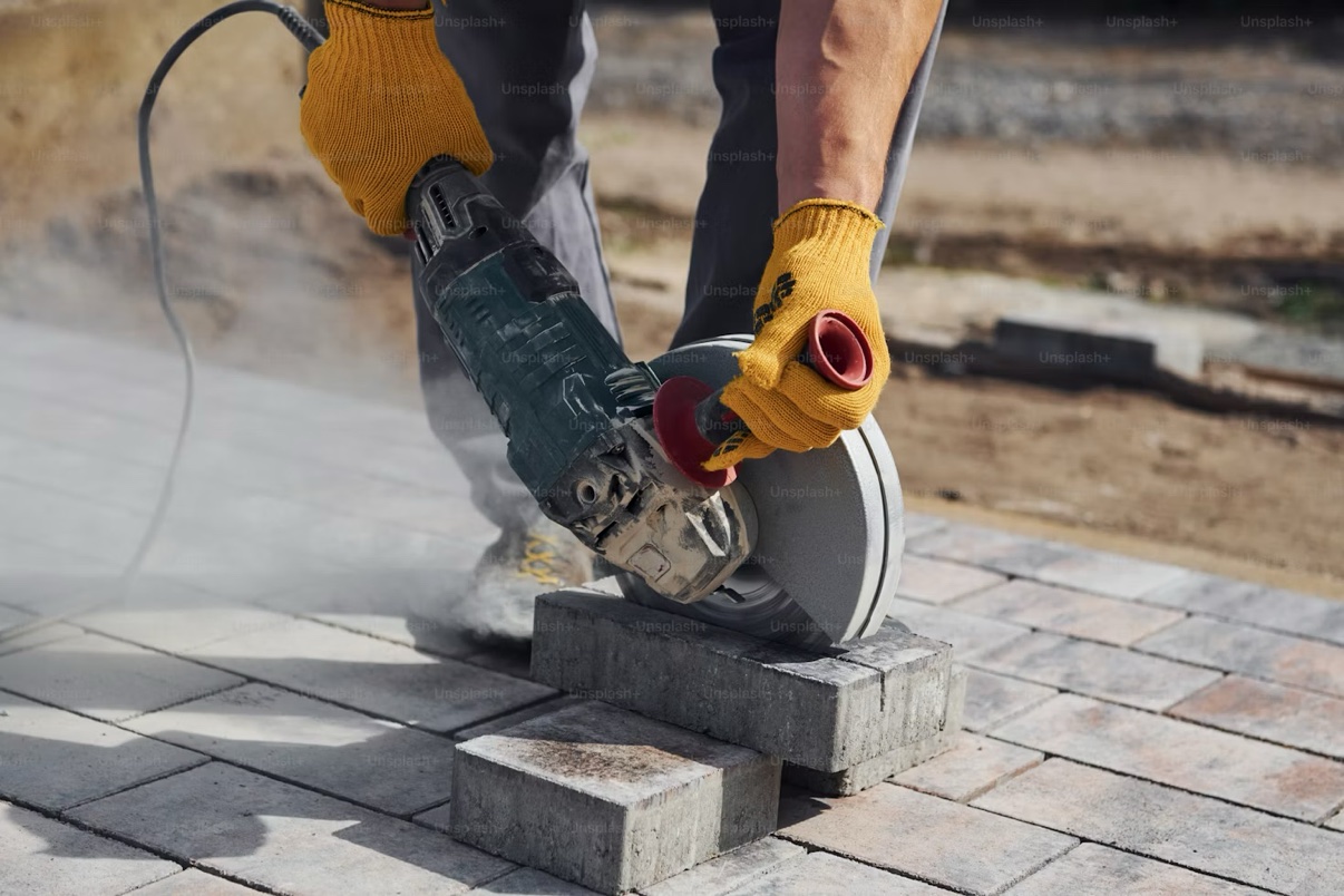 Cutting pavers for a custom patio installation