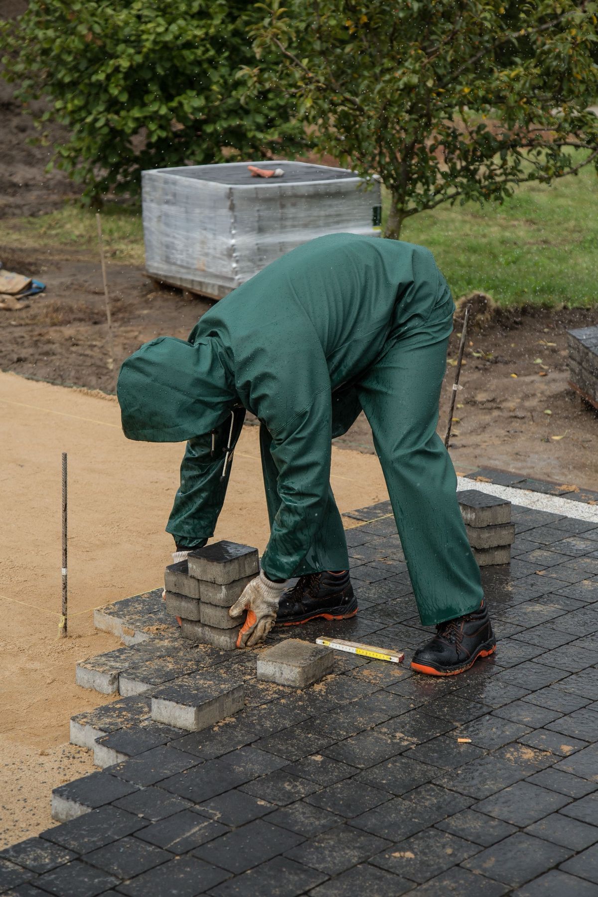 Pavers being laid on a screeded base